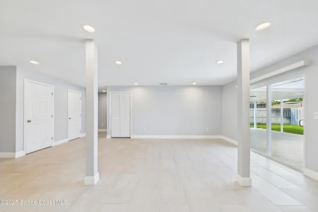 a kitchen with stainless steel appliances a refrigerator sink and white cabinets