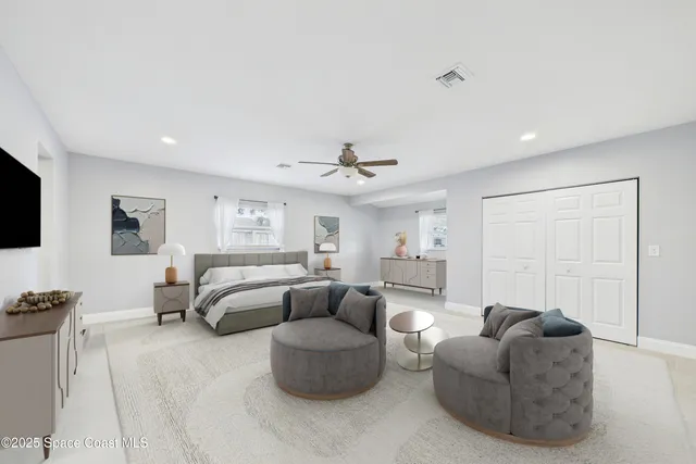 a spacious bathroom with a granite countertop sink toilet and shower
