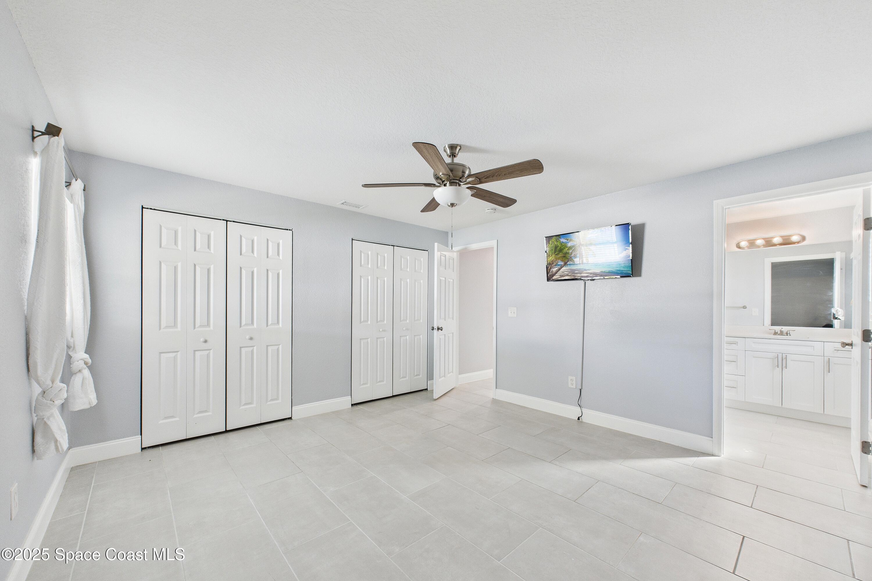 1500 Dorsal Street Merritt Island, FL 32952 - Photo 34 of 56 a view of a livingroom with a ceiling fan and window