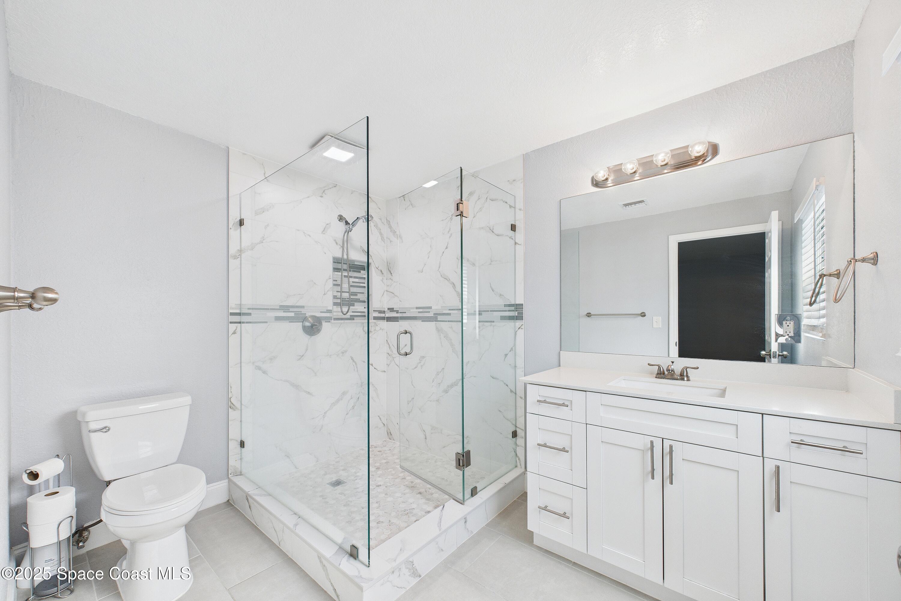 1500 Dorsal Street Merritt Island, FL 32952 - Photo 35 of 56 a bathroom with a toilet sink and shower