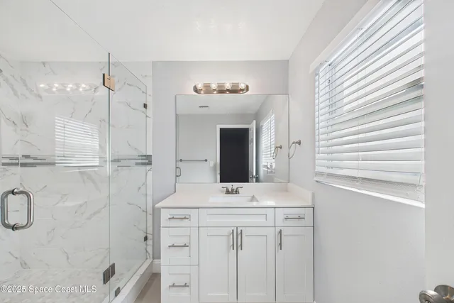 an empty room with a fan and a ceiling fan