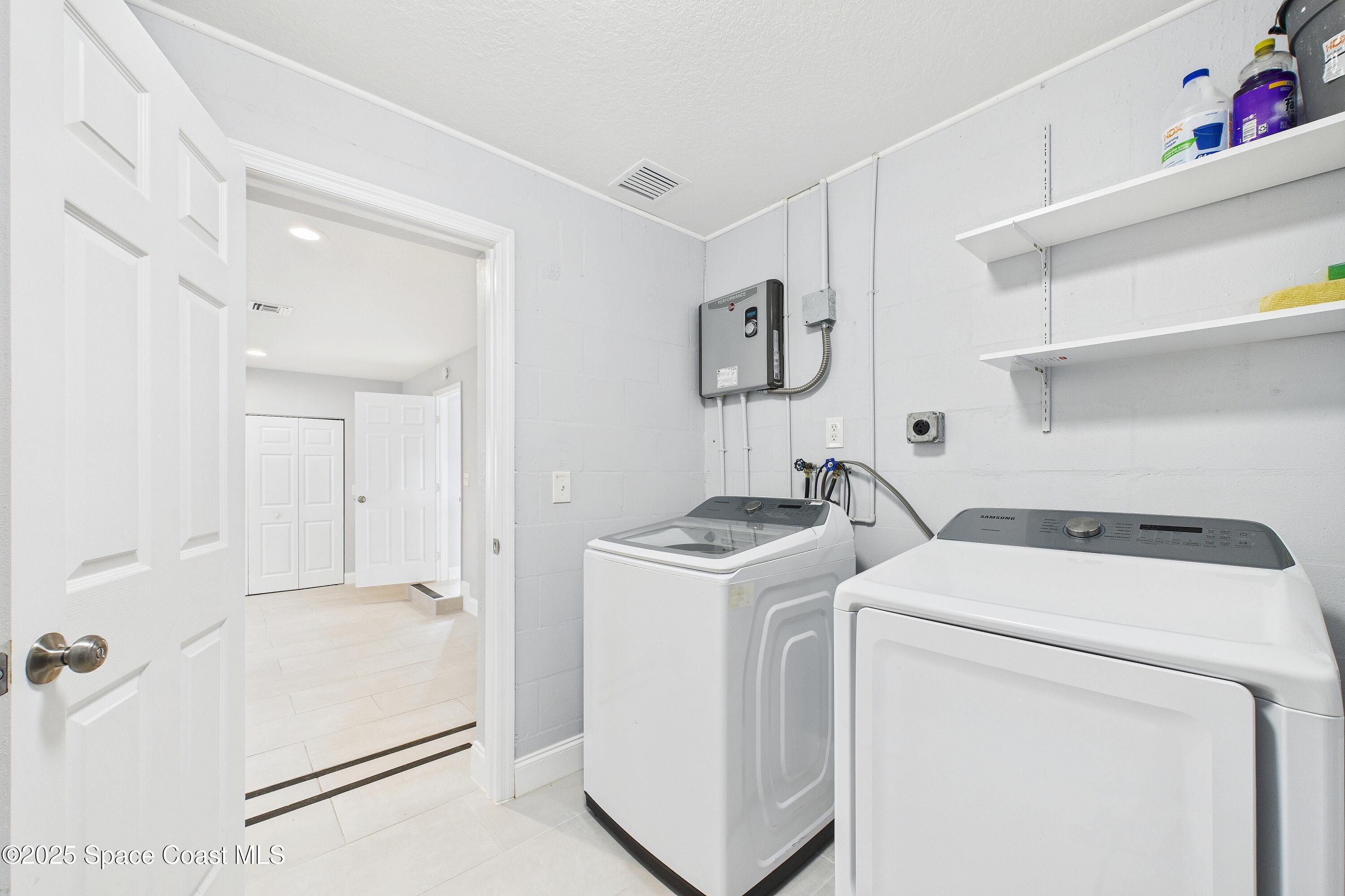 1500 Dorsal Street Merritt Island, FL 32952 - Photo 43 of 56 a utility room with dryer and washer