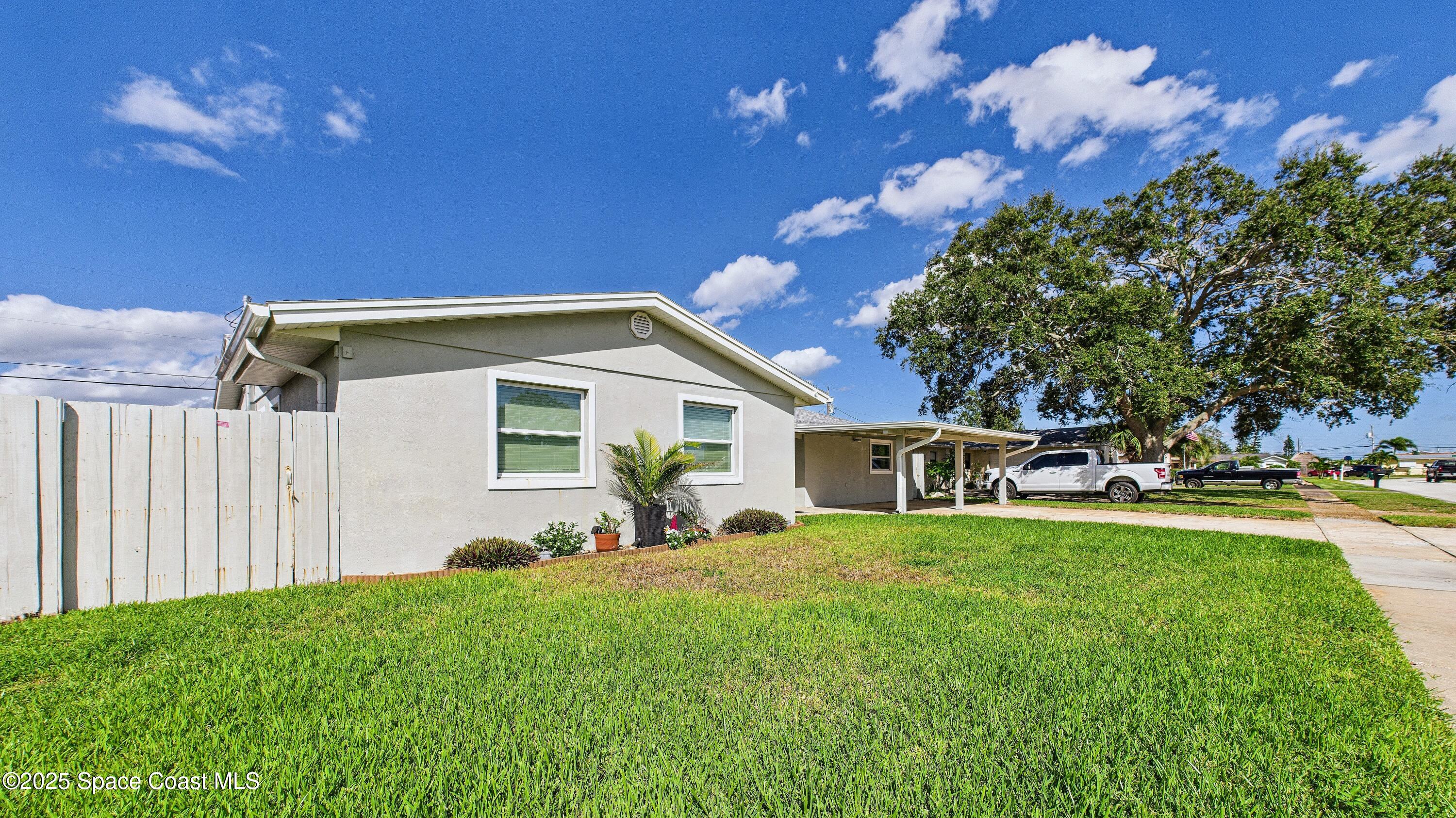 1500 Dorsal Street Merritt Island, FL 32952 - Photo 5 of 56 a view of a house with backyard sitting area and garden