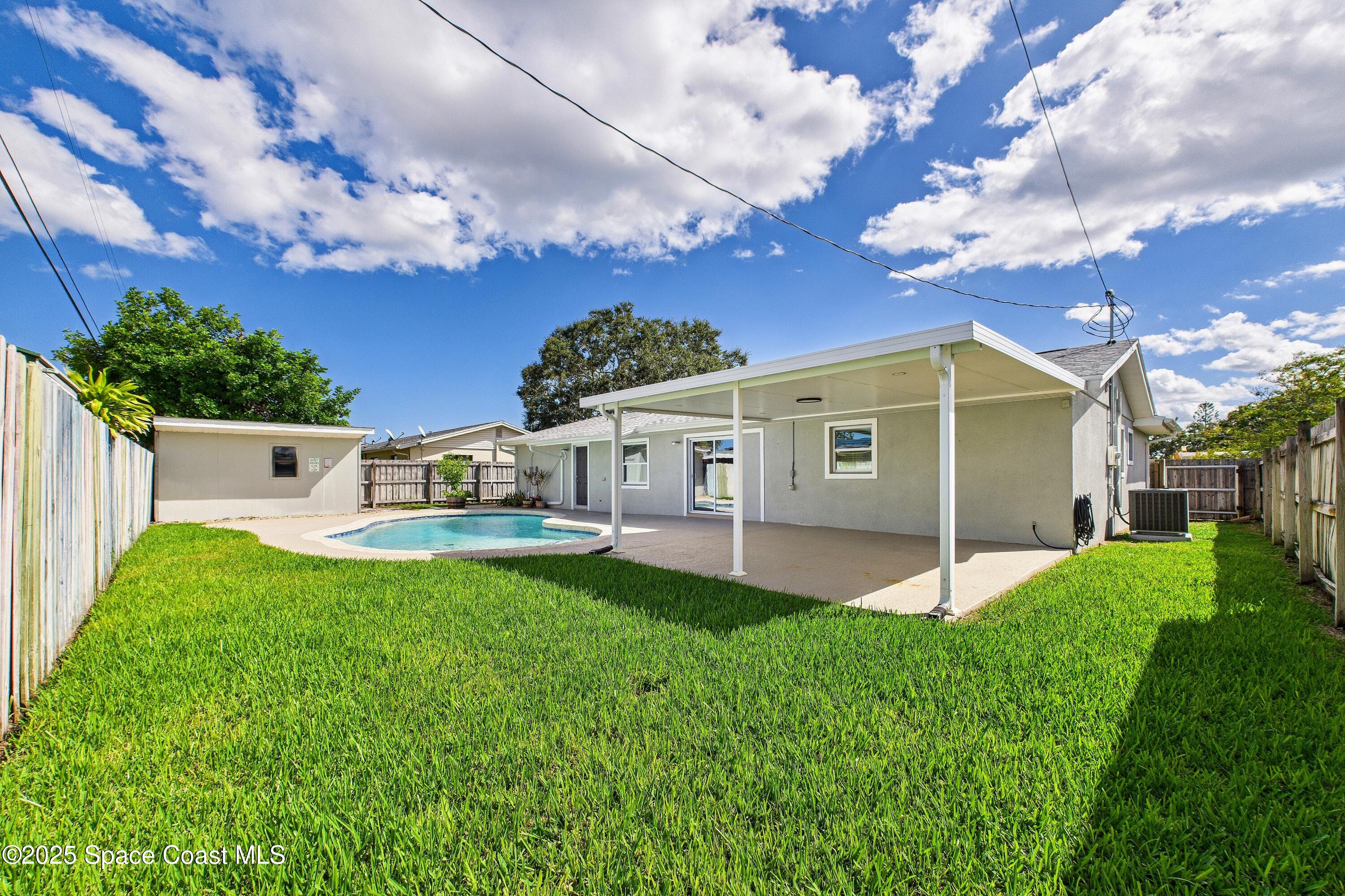 1500 Dorsal Street Merritt Island, FL 32952 - Photo 51 of 56 a front view of house with yard and green space