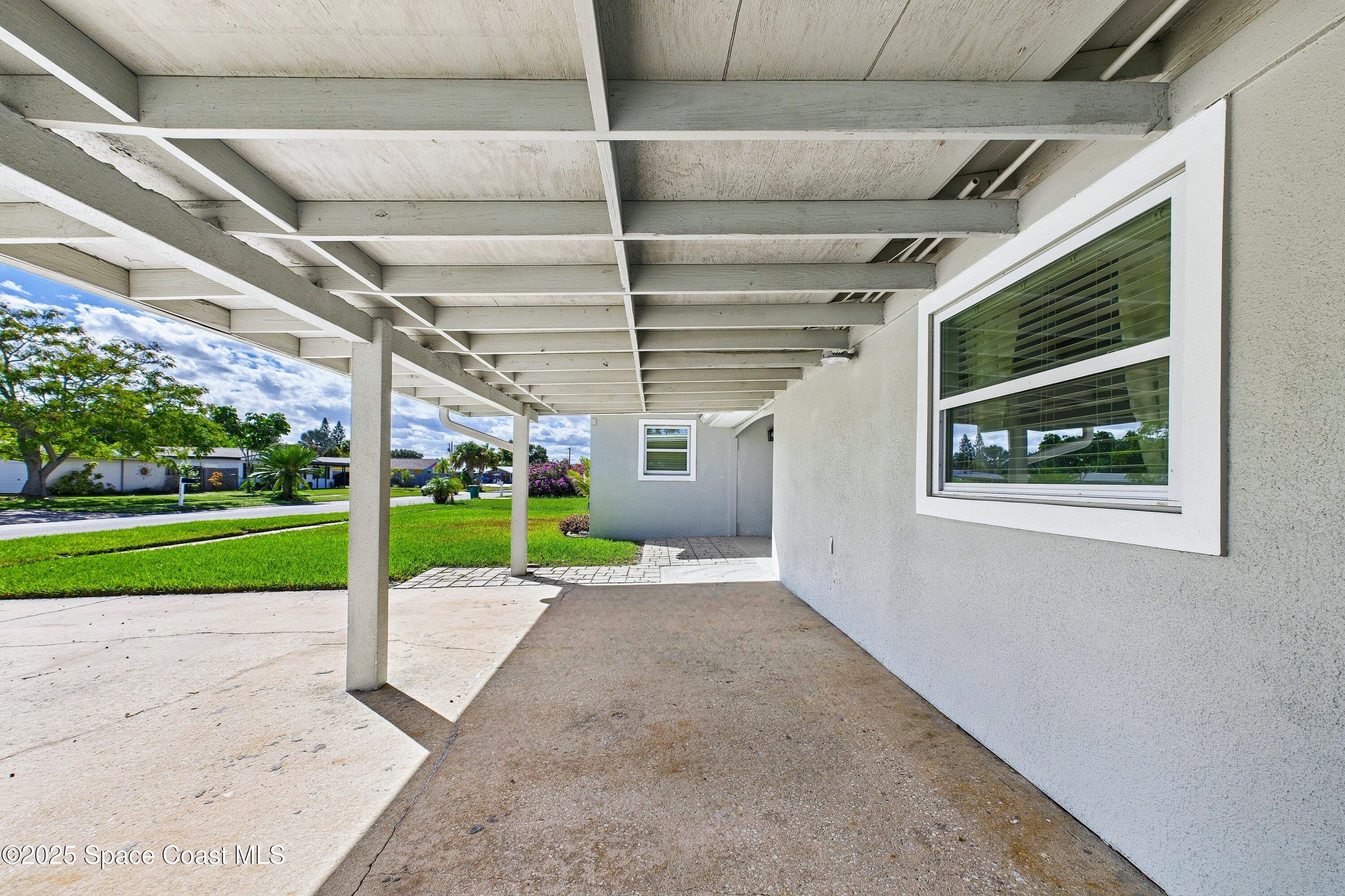 1500 Dorsal Street Merritt Island, FL 32952 - Photo 6 of 56 a view of a porch with a yard