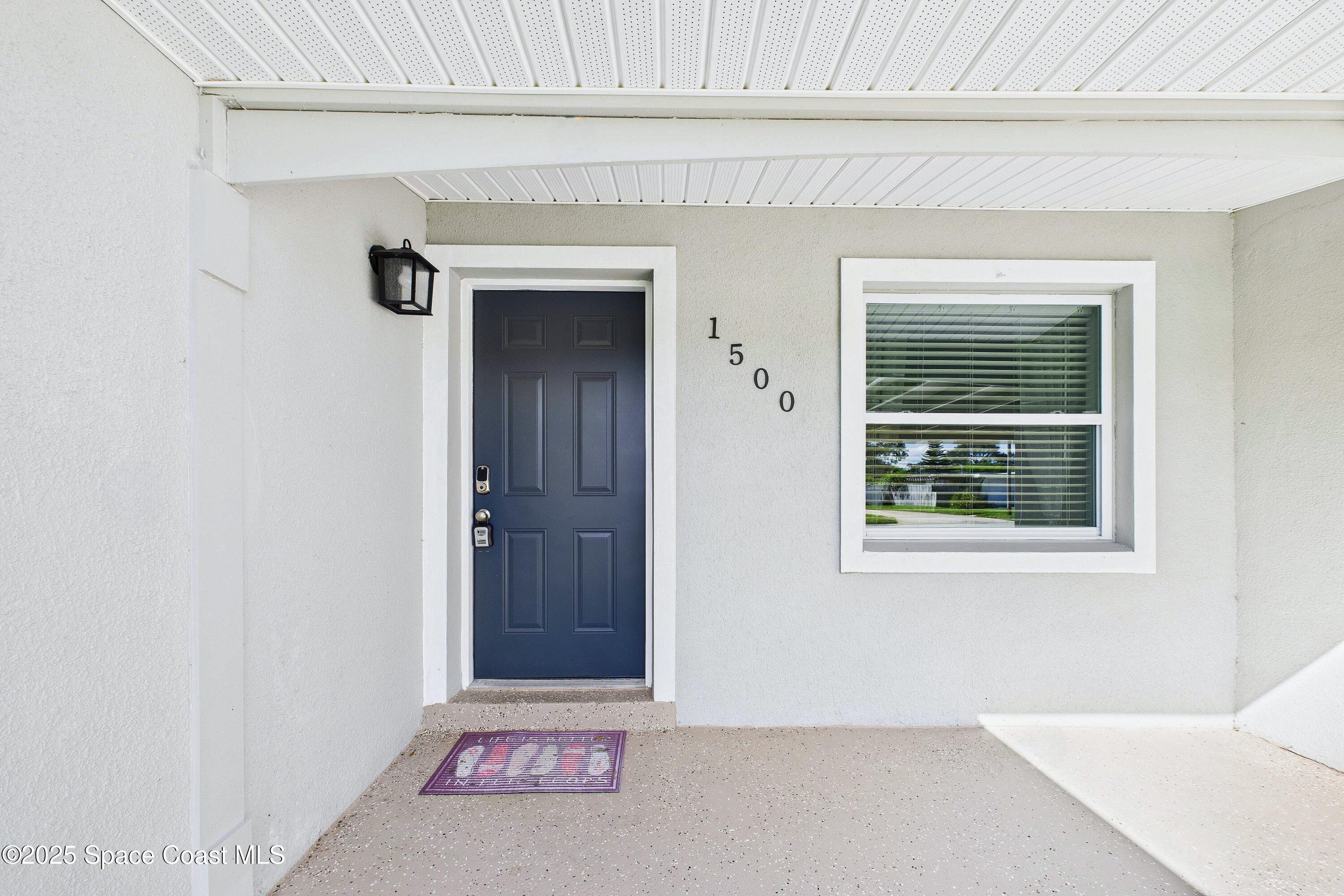 1500 Dorsal Street Merritt Island, FL 32952 - Photo 7 of 56 a view of a door and a window in a room
