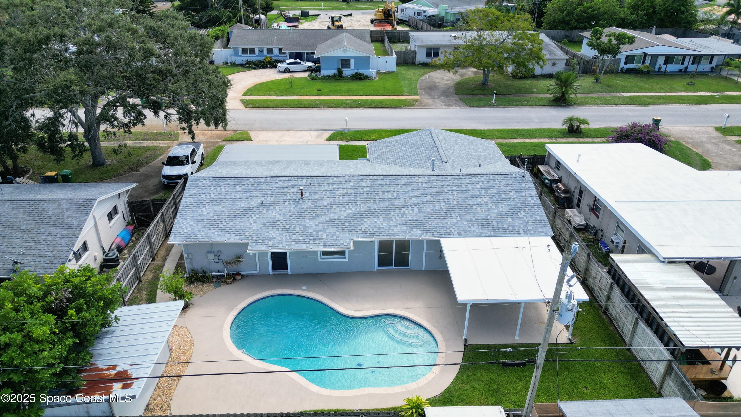 1500 Dorsal Street Merritt Island, FL 32952 - Photo 9 of 56 an aerial view of a house with swimming pool and patio
