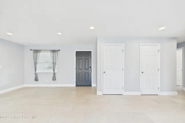a view of kitchen with stainless steel appliances refrigerator oven and microwave