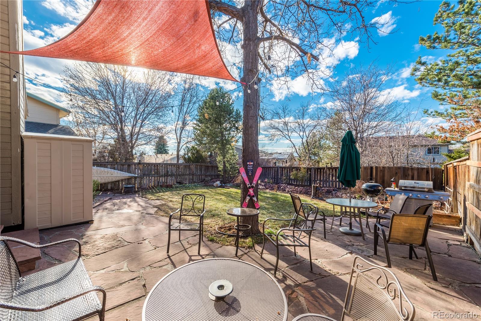 8583 Redstone Street Highlands Ranch, CO 80126 - Photo 20 of 25 a view of a backyard with sitting area