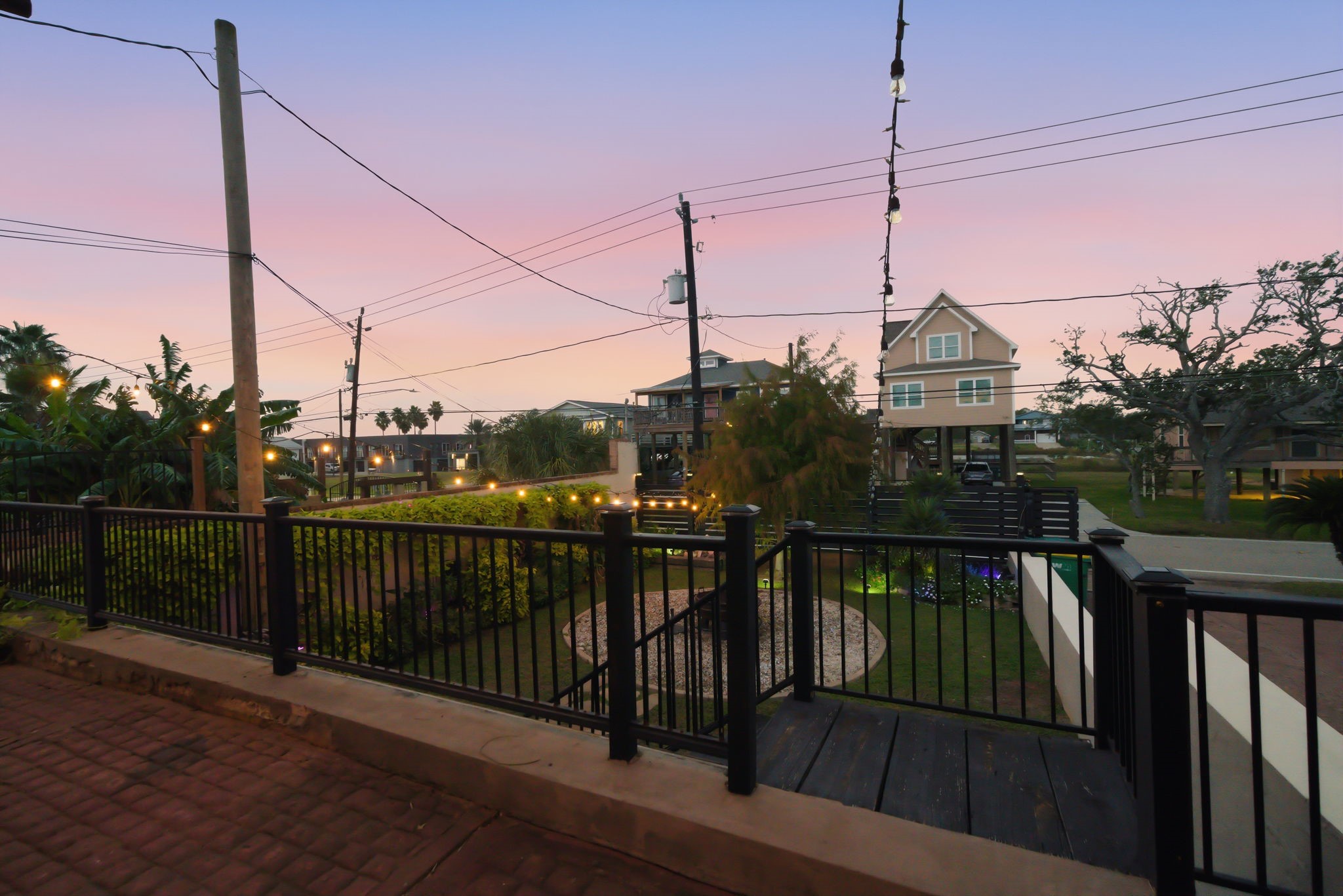 1918 Todville Road Seabrook, TX 77586 - Photo 9 of 41 An elevated terrace behind the storage area offers a great vantage point over the intimate front courtyard, with steps leading down to this inviting outdoor gathering area.