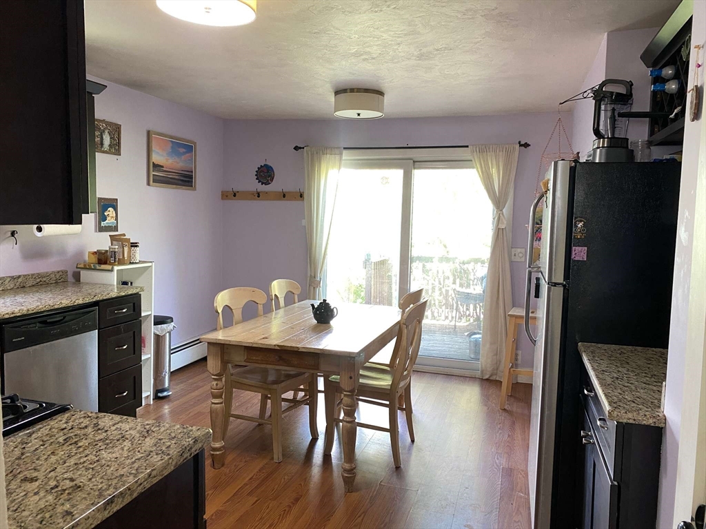 8 May Street Beverly, MA 01915 - Photo 7 of 25 a view of a dining room with furniture window and wooden floor