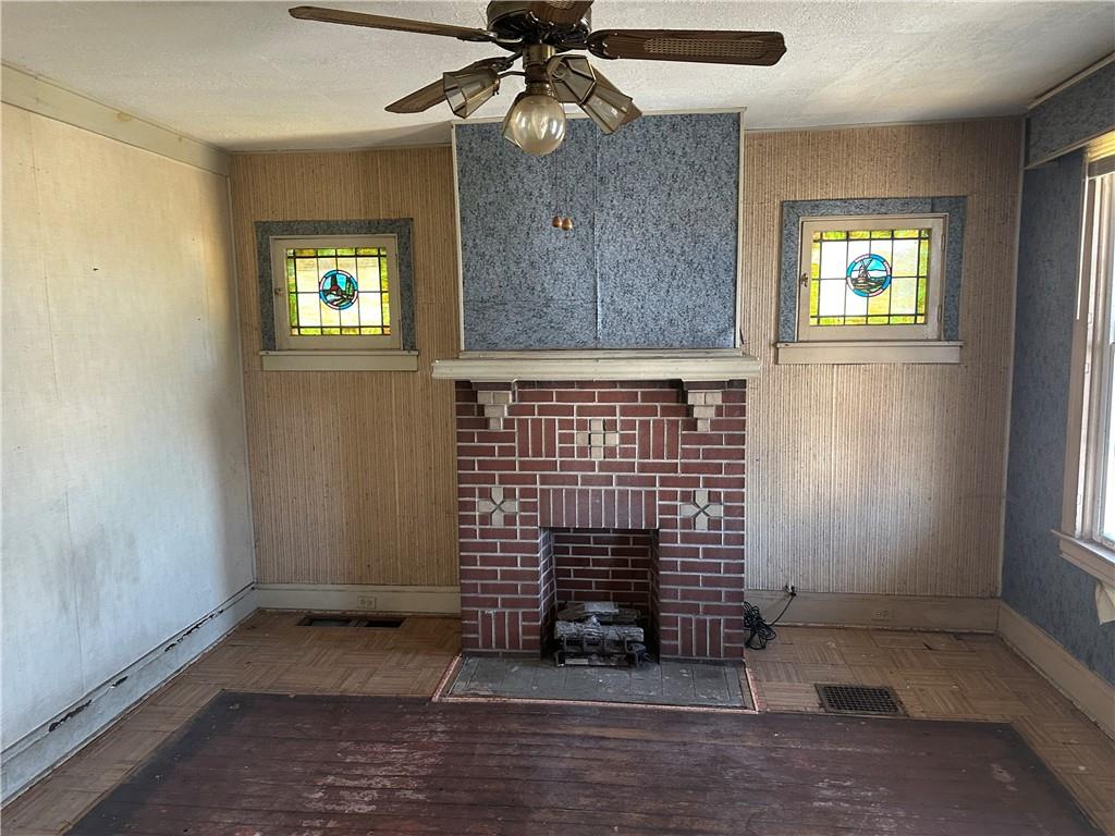 124 East 15th Avenue Homestead, PA 15120 - Photo 2 of 15 an empty room with windows and fan
