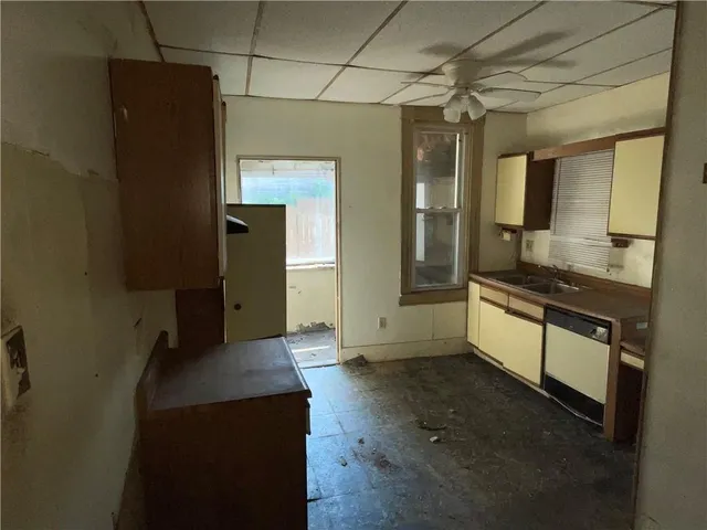 a view of a refrigerator in a kitchen
