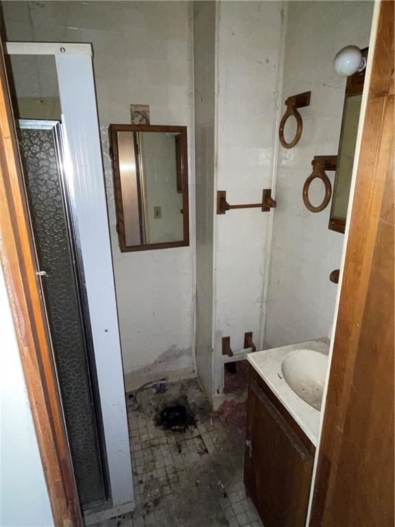 124 East 15th Avenue Homestead, PA 15120 - Photo 6 of 15 a bathroom with a sink and mirror