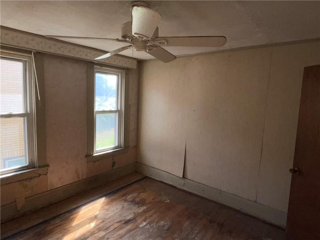 124 East 15th Avenue Homestead, PA 15120 - Photo 9 of 15 a view of a livingroom with a window