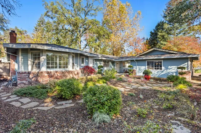 a front view of a house with garden