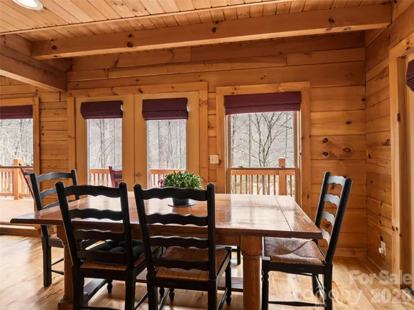 a view of a dining room with furniture and windows