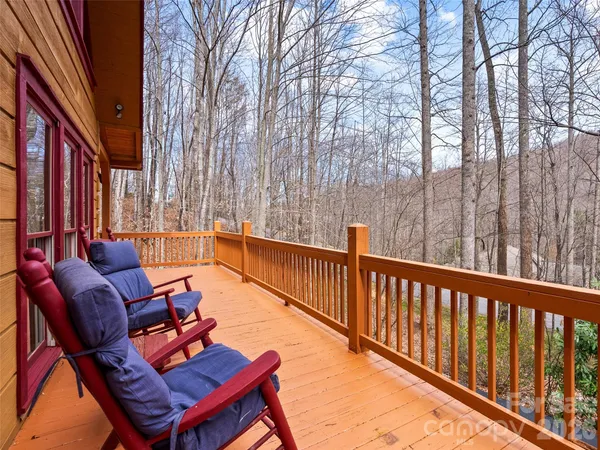 a wooden bench sitting in front of building