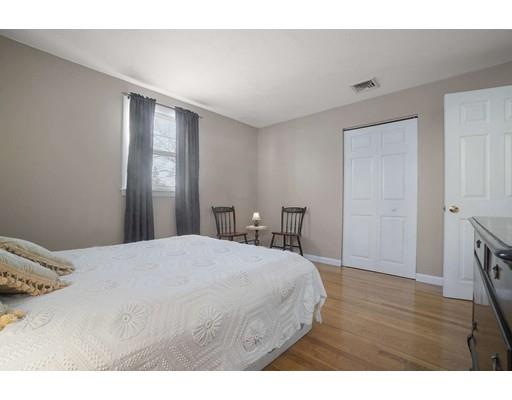 40 Sunflower Road Holbrook, MA 02343 - Photo 12 of 26 a bedroom with a bed and a table