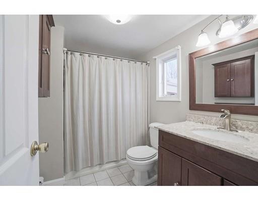 40 Sunflower Road Holbrook, MA 02343 - Photo 15 of 26 a bathroom with a toilet a sink and mirror
