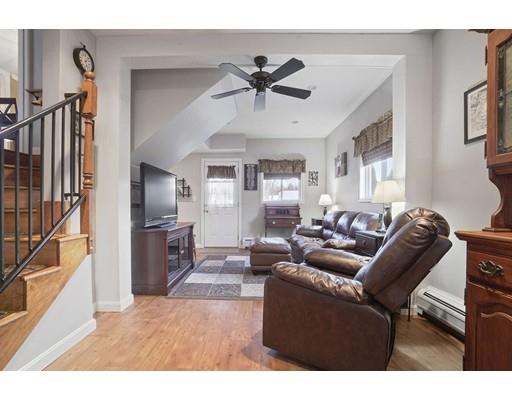 40 Sunflower Road Holbrook, MA 02343 - Photo 19 of 26 a living room with furniture a ceiling fan and a window