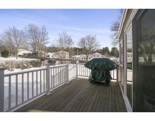 40 Sunflower Road Holbrook, MA 02343 - Photo 22 of 26 a view of a balcony with wooden floor and bench