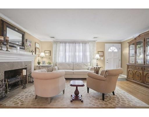 40 Sunflower Road Holbrook, MA 02343 - Photo 4 of 26 a living room with furniture a fireplace and large windows