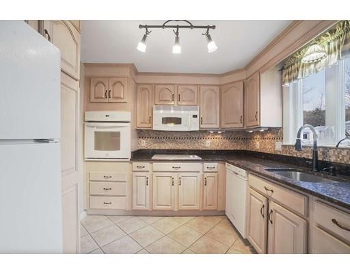 40 Sunflower Road Holbrook, MA 02343 - Photo 6 of 26 a kitchen with granite countertop a sink cabinets and stainless steel appliances