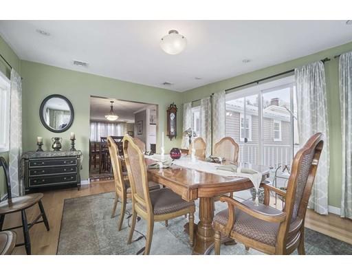 40 Sunflower Road Holbrook, MA 02343 - Photo 8 of 26 a view of a dining room with furniture and a large window