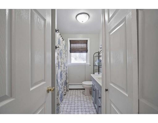 40 Sunflower Road Holbrook, MA 02343 - Photo 9 of 26 a bathroom with a toilet a sink and a window