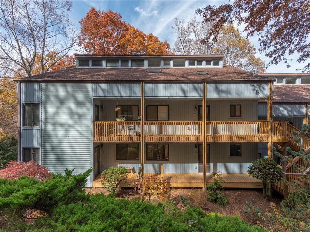 87 Willow Road, Unit A2 Waynesville, NC 28786 - Photo 23 of 29 a front view of a house with a yard