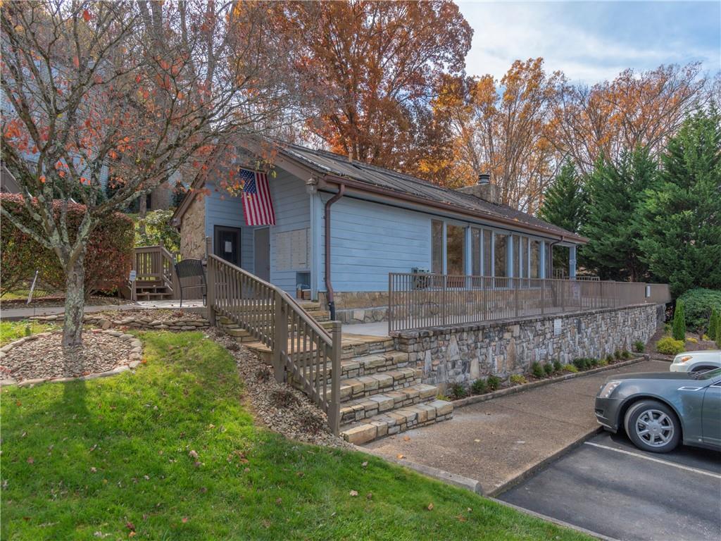 87 Willow Road, Unit A2 Waynesville, NC 28786 - Photo 26 of 29 a front view of a house with garden