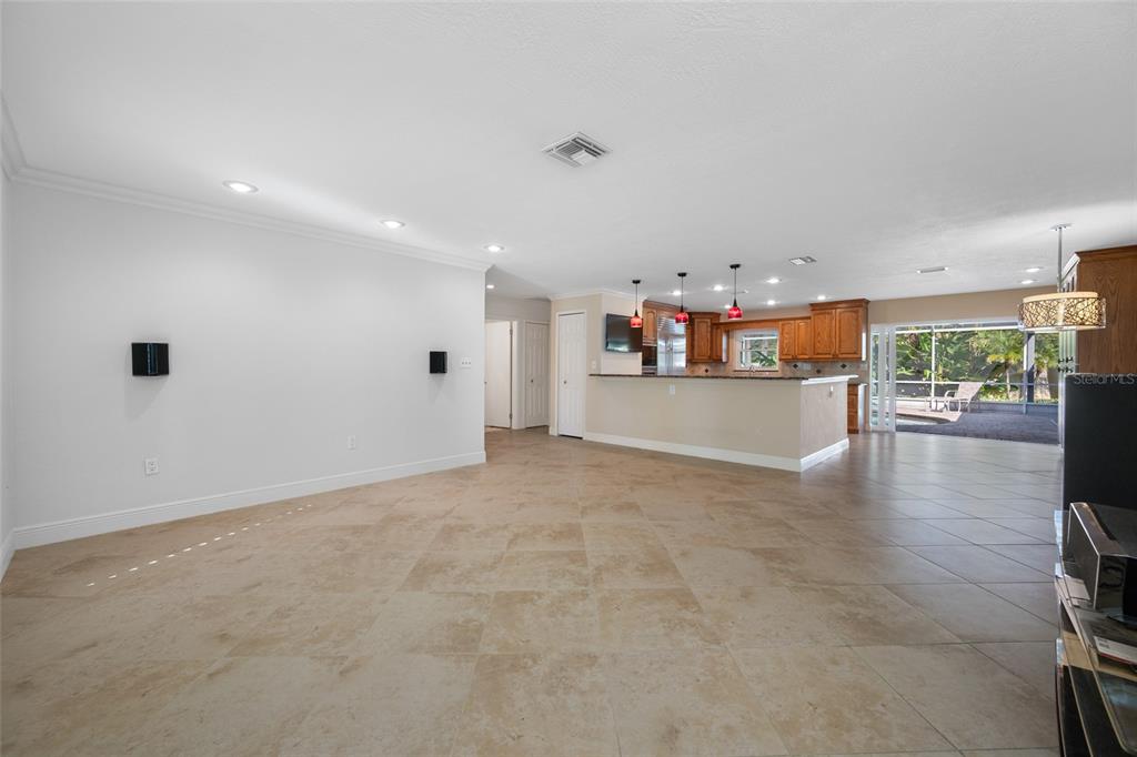 5473 97th Way North St. Petersburg, FL 33708 - Photo 12 of 62 a view of a kitchen with furniture and wooden floor
