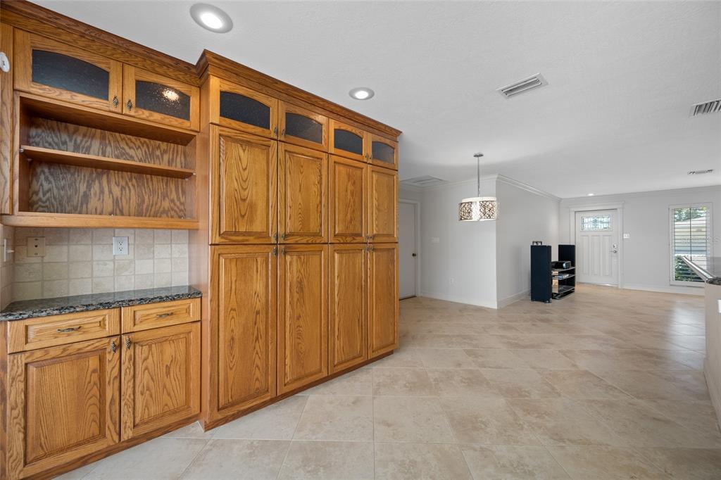 5473 97th Way North St. Petersburg, FL 33708 - Photo 18 of 57 a view of a storage & utility room with cabinet