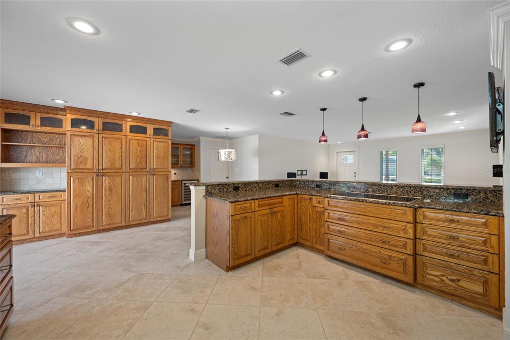 5473 97th Way North St. Petersburg, FL 33708 - Photo 20 of 57 a large kitchen with stainless steel appliances granite countertop a refrigerator and a sink