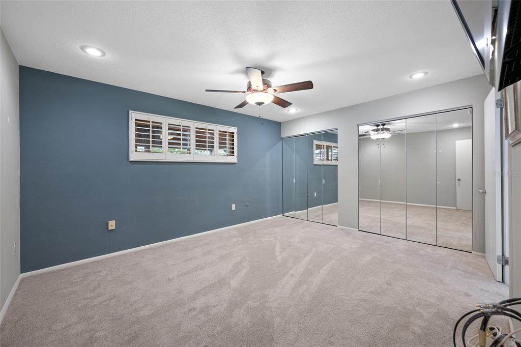 5473 97th Way North St. Petersburg, FL 33708 - Photo 22 of 57 a view of an empty room with a ceiling fan