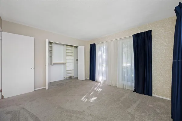 a view of a room with closet and entryway