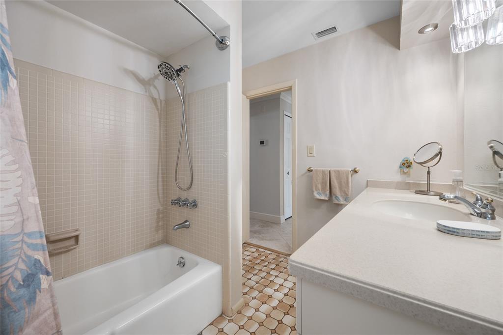 5473 97th Way North St. Petersburg, FL 33708 - Photo 34 of 57 a bathroom with a bathtub and a sink