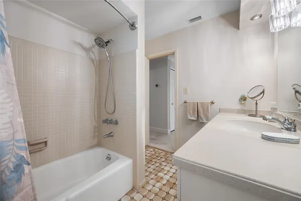 a bathroom with a bathtub and a sink