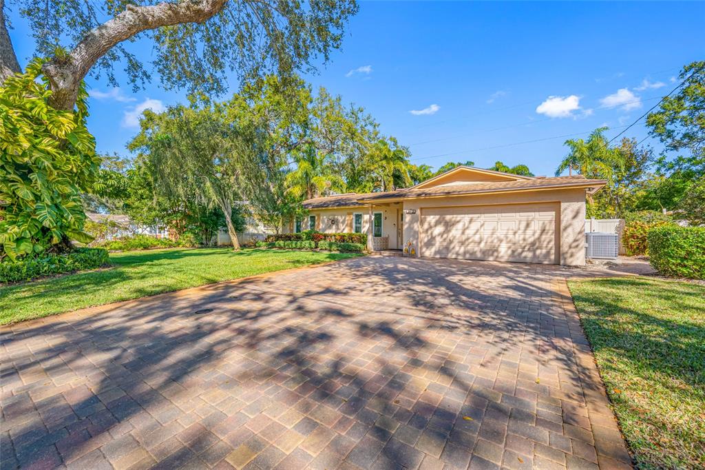 5473 97th Way North St. Petersburg, FL 33708 - Photo 4 of 57 a view of a house with a yard