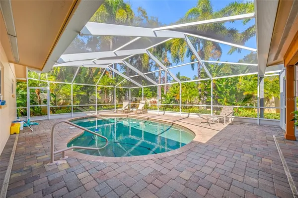 a view of a swimming pool with a lounge chairs