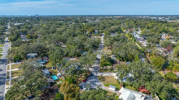 an aerial view of residential building and lake