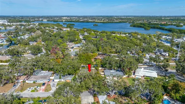 an aerial view of residential building and lake