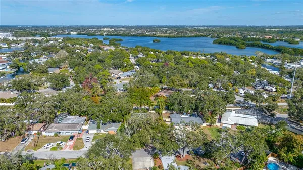 an aerial view of a house with a yard