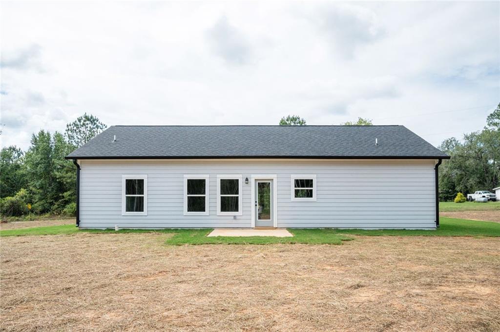 512 Branch Street Cedartown, GA 30125 - Photo 34 of 36 a front view of a house with a yard and garage