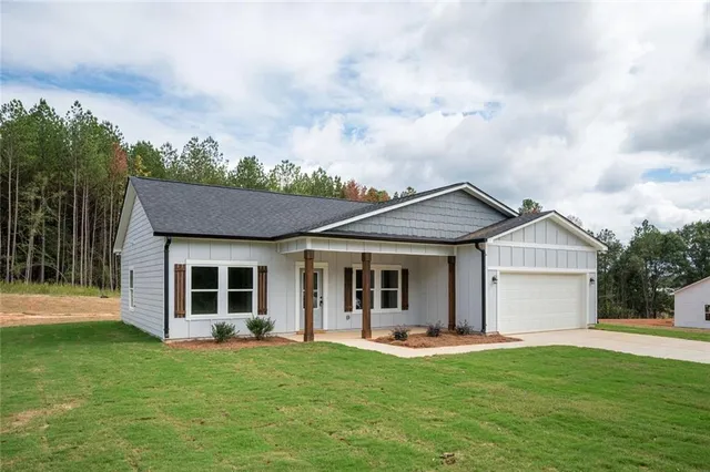 a view of a kitchen with a sink and a refrigerator