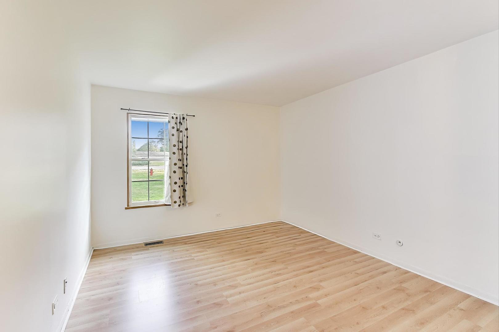 691 Wakefield Road, Unit 691 Gurnee, IL 60031 - Photo 11 of 26 an empty room with a window