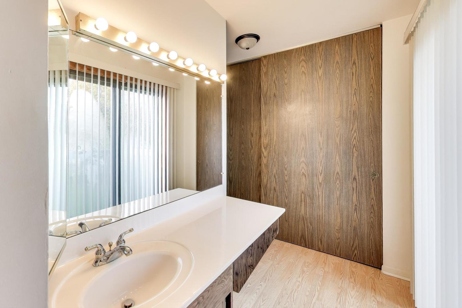 691 Wakefield Road, Unit 691 Gurnee, IL 60031 - Photo 21 of 26 a bathroom with a bathtub and a shower