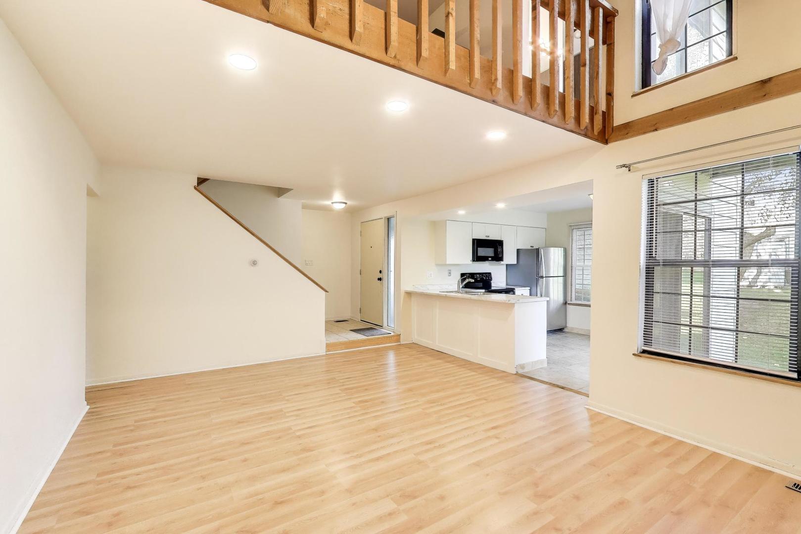 691 Wakefield Road, Unit 691 Gurnee, IL 60031 - Photo 7 of 26 a view of an entryway with kitchen and windows