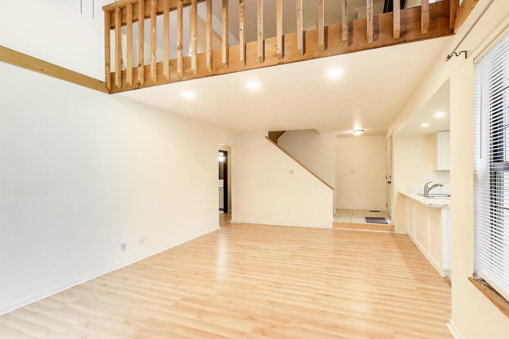 691 Wakefield Road, Unit 691 Gurnee, IL 60031 - Photo 8 of 26 a view of a hallway with stairs